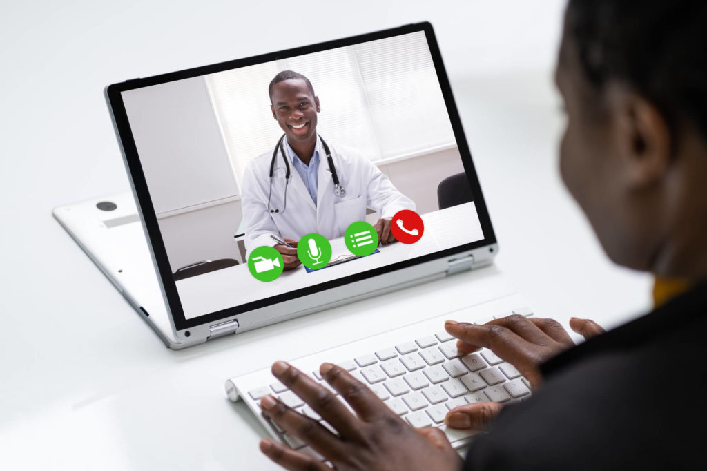 Woman Having Video Conference Web Call With Doctor
