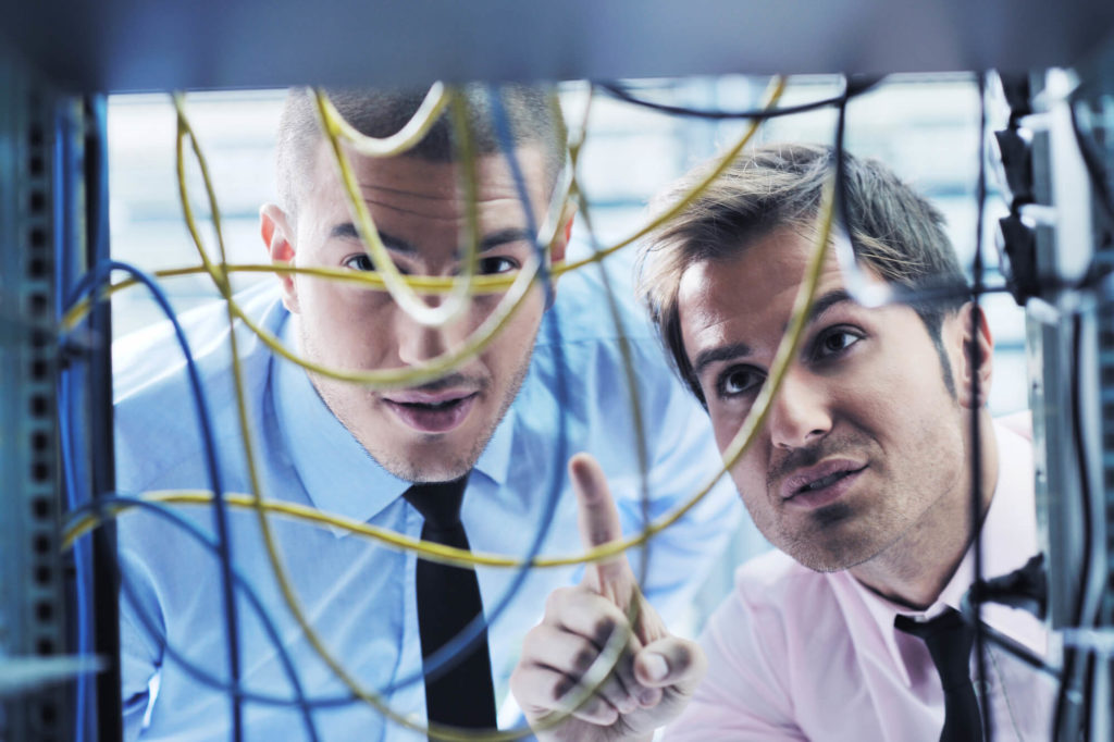 IT engineers in network server room