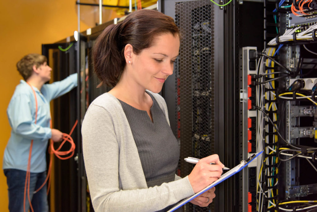 Woman IT engineer in server room