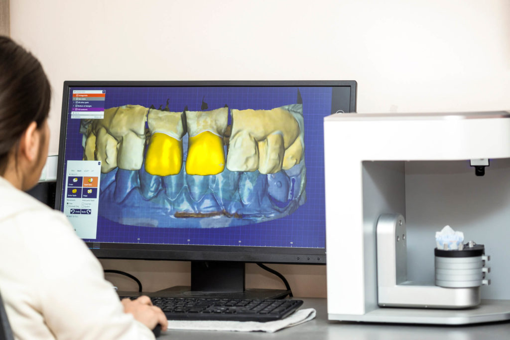 dentist uses IT solutions for dental practices