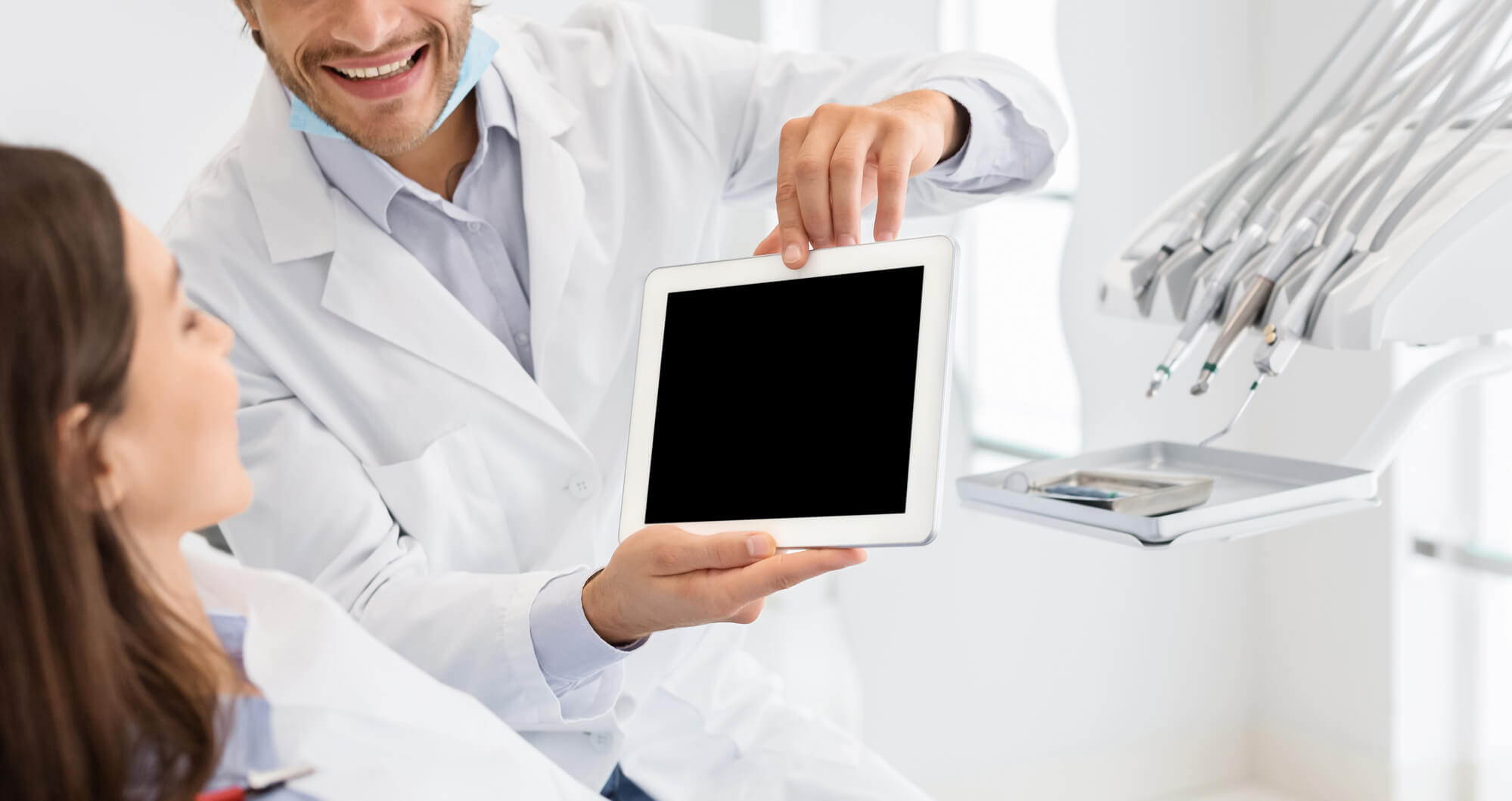 dentist shows IT solutions for dental practices