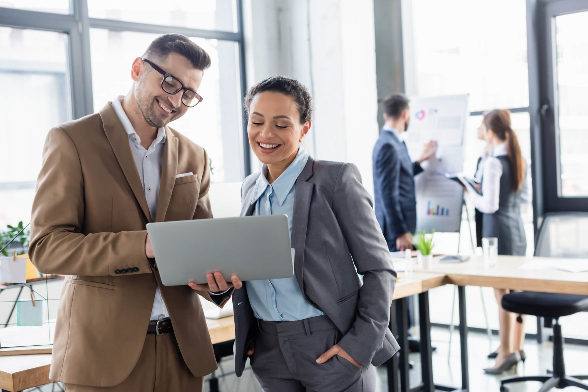 Two people seeing documents at a successful company after getting IT support in west palm beach