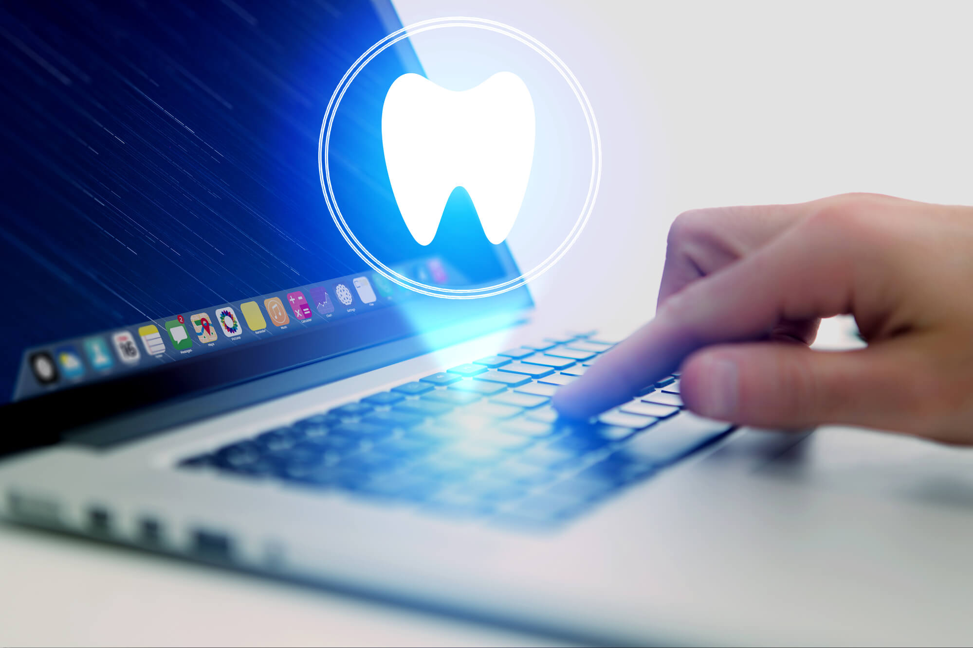 computer with tooth icon signaling IT services for dental practices