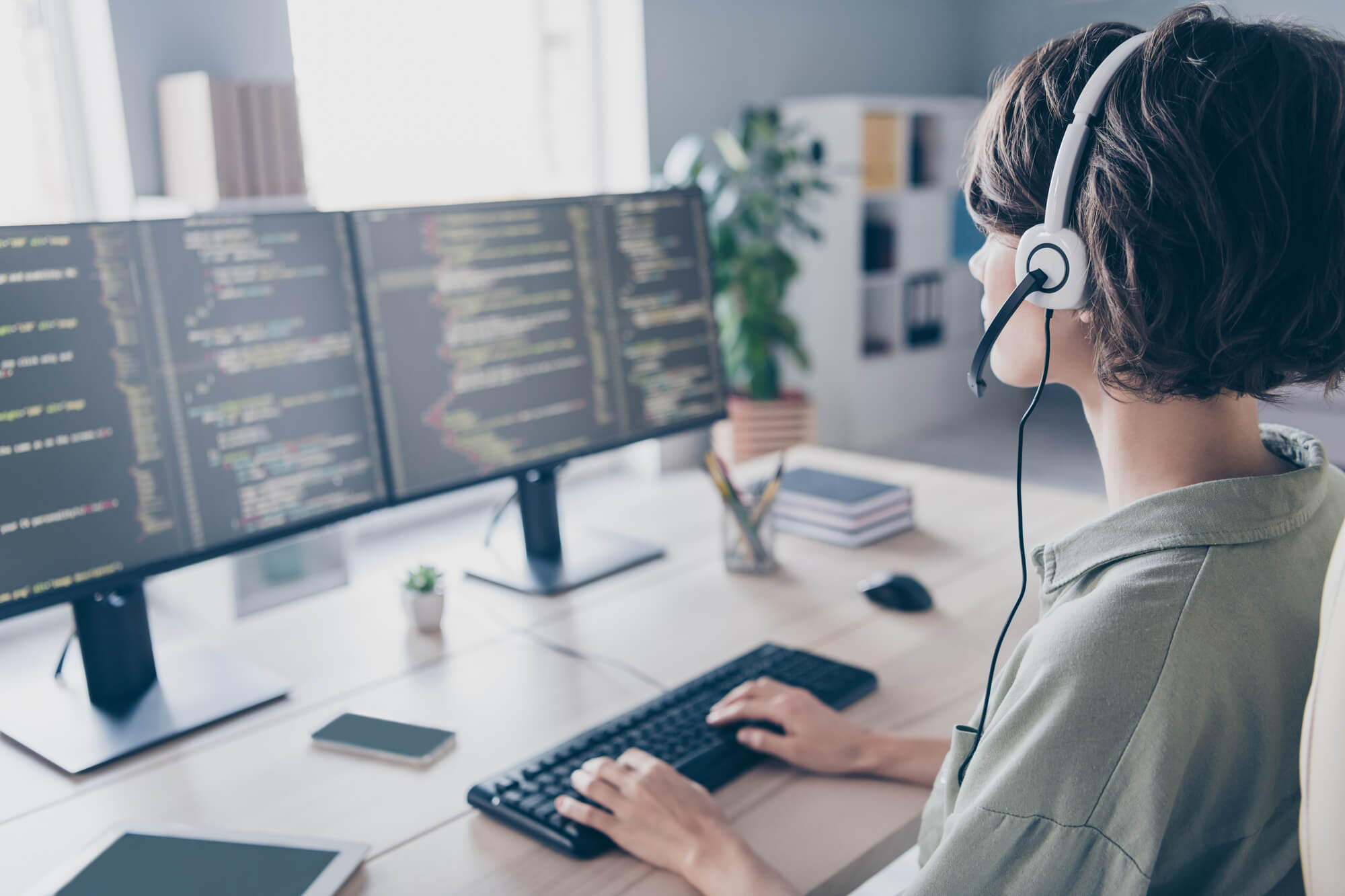 woman in front of her desk providing remote it support in west palm beach